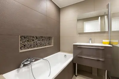 a bathroom with a tub and a sink at 2-Br apartment 2 minutes from the beach parking in Cannes
