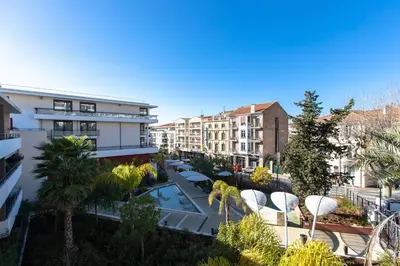 an aerial view of a city with buildings at Renovated 2-Br Apartment with Terrace and Pool in Cannes