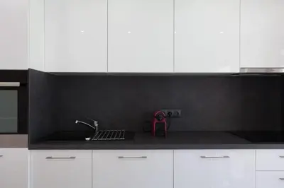 a kitchen with white cabinets and a sink and a counter at 3-Room Apartment with Terrace in Palm Beach in Cannes
