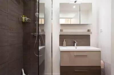 a bathroom with a sink and a shower at 3-Room Apartment with Terrace in Palm Beach in Cannes