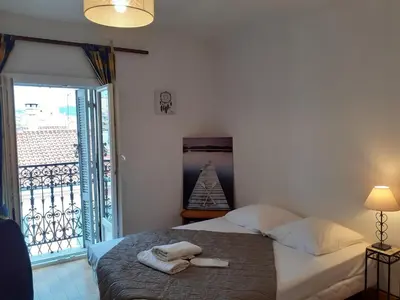 a bedroom with a bed with towels on it at Stella Apartment - Cannes in Cannes