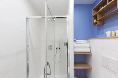 a shower with a glass door in a bathroom at Cannes NEW Apartment, Palais Des Festivals, CROISETTE, Beaches in Cannes