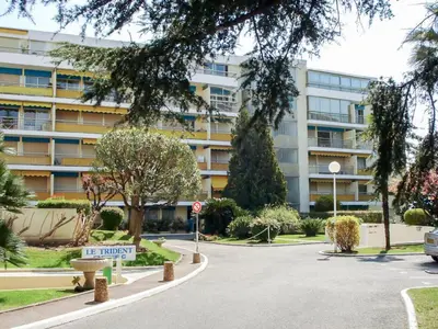 a parking lot in front of a large building at Apartment Le Trident by Interhome in Cannes