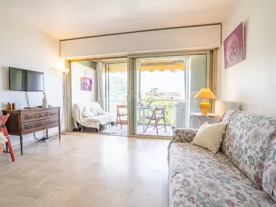 a living room with a couch and a table at Apartment Le Trident by Interhome in Cannes