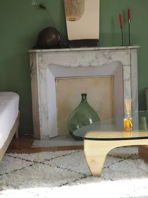 a living room with a bed and a couch at GRAND TROIS PIECES QUARTIER CROISETTE in Cannes