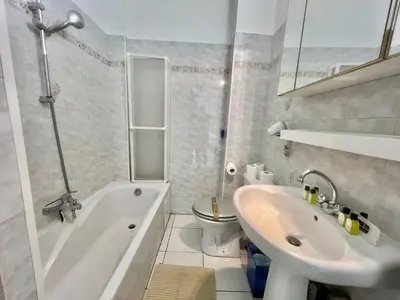 a bathroom with a tub and a sink and a toilet at Rocamare 2, by Welcome to Cannes in Cannes