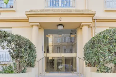 an entrance to a building with trees in front at IMMOGROOM - SEA VIEW - 2 min from beach - CONGRESSBEACHES in Cannes