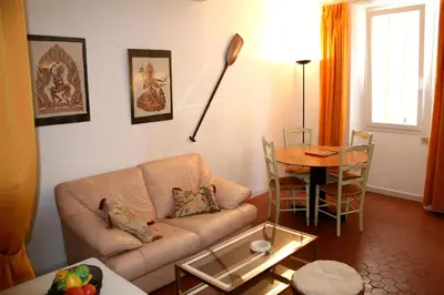 a room with a red carpet and a broom at Karolina Properties - Misericorde Appartements in Cannes