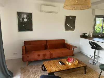 a living room with a couch and a coffee table at Modern cosy two bedrooms in Cannes , large terrace, 5 minutes from Croisette in Cannes