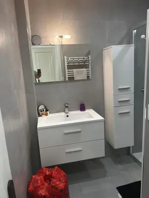 a bathroom with a white sink and a mirror at Modern cosy two bedrooms in Cannes , large terrace, 5 minutes from Croisette in Cannes