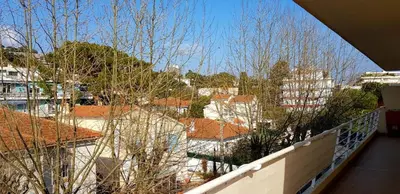 a balcony with a view of buildings and trees at Modern cosy two bedrooms in Cannes , large terrace, 5 minutes from Croisette in Cannes