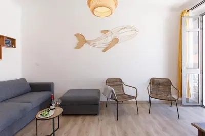 a living room with a couch and two chairs at La Colline YourHostHelper in Cannes