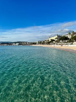 a view of a beach from the water at Prime Location Hyper Center Ideal for Couples & Families - Walk Everywhere - SMART by Totolulucannes in Cannes