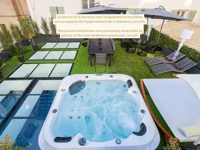 a hot tub on the roof of a building at Résidence Montaigne - Luxurious - 350m Palais - LRA Cannes in Cannes