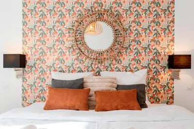 a bedroom with a mirror and a bed with pillows at Prime Location Hyper Center Ideal for Couples & Families - Walk Everywhere -By Totolulucannes in Cannes