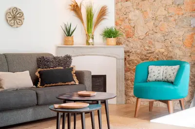 a living room with a couch and a chair and a table at Prime Location Hyper Center Ideal for Couples & Families - Walk Everywhere -By Totolulucannes in Cannes