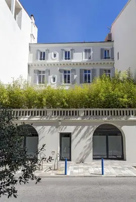 a white building with windows and plants on top at Prime Location Hyper Center Ideal for Couples & Families - Walk Everywhere -By Totolulucannes in Cannes