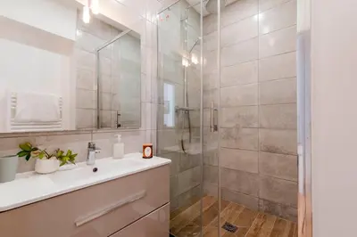 a bathroom with a sink and a shower at Prime Location Hyper Center Ideal for Couples & Families - Walk Everywhere -By Totolulucannes in Cannes