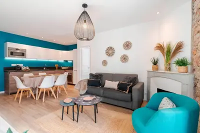 a living room with a couch and a table at Prime Location Hyper Center Ideal for Couples & Families - Walk Everywhere -By Totolulucannes in Cannes
