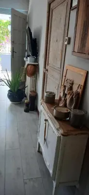 a kitchen with a stove with pots and pans on it at Au fil de l eau in Cannes
