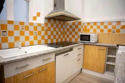 a kitchen with a sink and a microwave at Central Cannes, 200m to Palais, walk everywhere in Cannes
