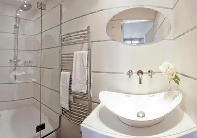 a white bathroom with a sink and a mirror at RG Duplex - Sea View - Palais & Croisette - Luxury Stay by LRA Cannes in Cannes