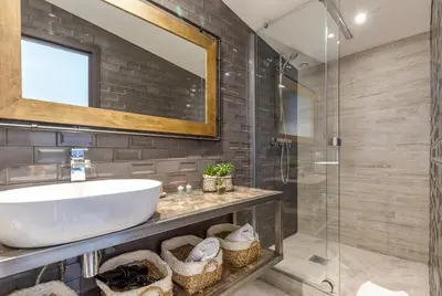 a bathroom with a sink and a glass shower at Residence Provencal - Luxurious - 300m Palais - LRA CANNES in Cannes