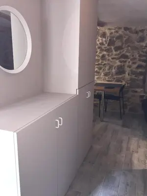 a room with a counter with a mirror and a table at Studio Suquet Saint Antoine in Cannes