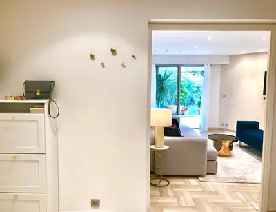 a living room with a couch and a table at 19 Rue du Parc Alexandre III in Cannes