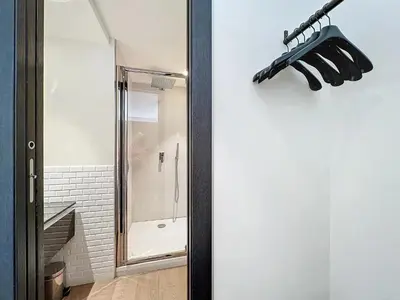 a bathroom with a shower and a glass door at 3P BETWEEN CROISETTE BEACHES AND ANTIBES STREET in Cannes