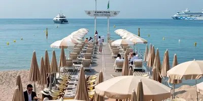 a bunch of chairs and umbrellas on a beach at 3P BETWEEN CROISETTE BEACHES AND ANTIBES STREET in Cannes