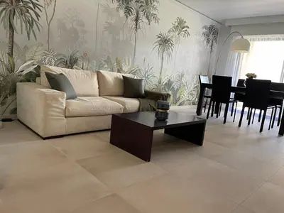 a living room with a couch and a table at Domaine D'Ahmosis, modern 2 bedrooms refurbished apartment, f3 moderne fraichement rénové in Le Cannet