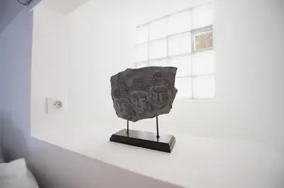 a sculpture on a shelf in a white room at 6 Rue Coste Corail in Cannes
