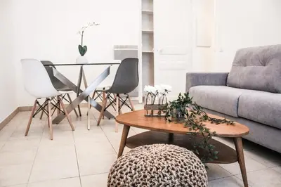 a living room with a couch and a table at Best quality price ! - Central - 350m Palais and Croisette in Cannes