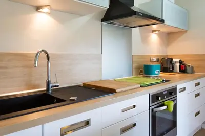 a kitchen with a sink and a counter top at Cannes Vacances chez Steph in Cannes