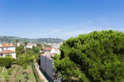 an aerial view of a town with houses and trees at Cannes Vacances chez Steph in Cannes