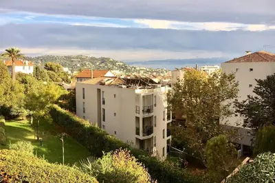 a view of a city with buildings and trees at Cannes Vacances chez Steph in Cannes