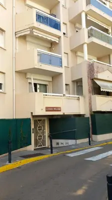 an apartment building with a door in front of it at Calm Flat in Cannes