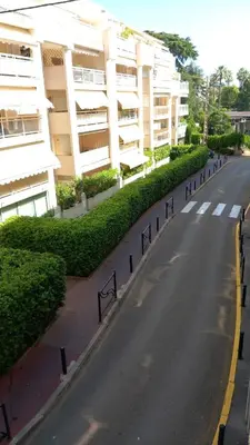 an empty street in front of a building at Calm Flat in Cannes