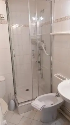 a bathroom with a shower and a toilet and a sink at Calm Flat in Cannes
