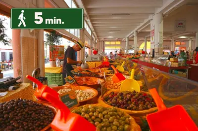 a market filled with lots of fruits and vegetables at Grand Studio Cannes Centre in Cannes