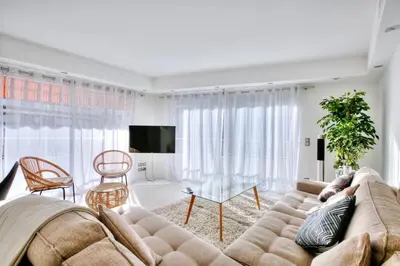 a living room with a couch and a table at REF 1147 - Cannes Center - Apartment for rent in Cannes