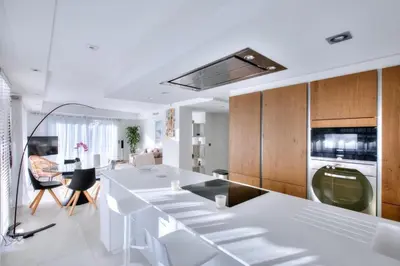 a kitchen with a white counter top in a room at REF 1147 - Cannes Center - Apartment for rent in Cannes