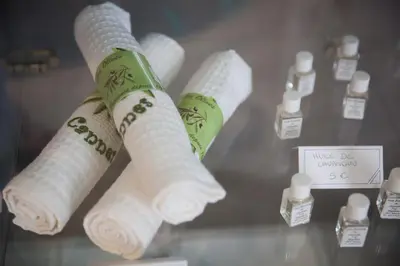 three rolls of toilet paper on a glass shelf at Hotel Cannes Croisette in Cannes