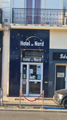 a hotel on the corner of a building at Hôtel du Nord in Cannes