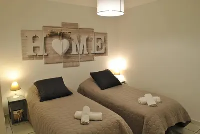 a bedroom with two beds and a valentine sign on the wall at Centre Riviera 2P LHO5516 in Cannes