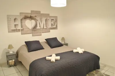 a bedroom with a bed with two towels on it at Centre Riviera 2P LHO5516 in Cannes