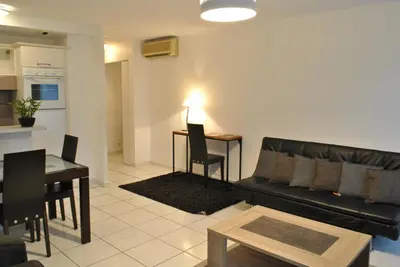 a living room with a couch and a table at Centre Riviera 2P LHO5516 in Cannes