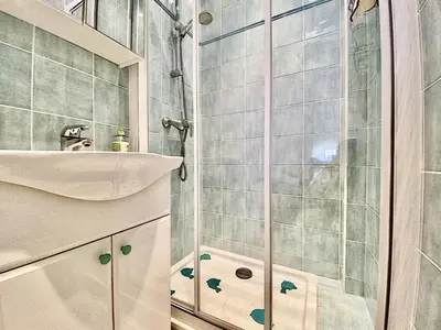 a bathroom with a sink and a shower at Palais Hoche 2P LON5218 in Cannes