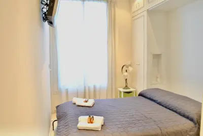a bedroom with a bed with two towels on it at Palais Hoche 2P LON5218 in Cannes
